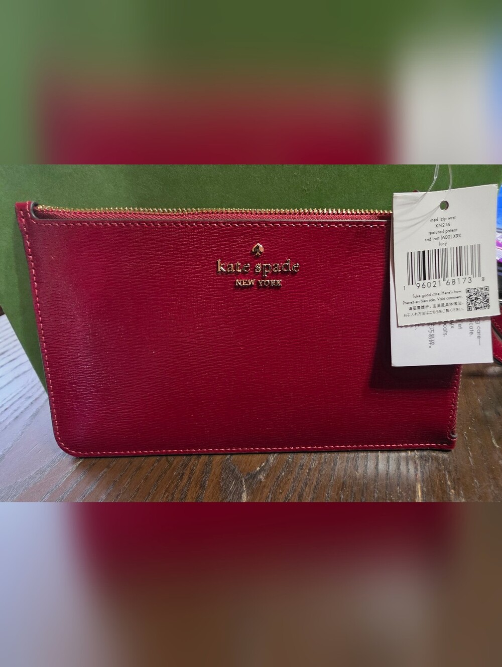 kate spade red leather wristlet with gold logo